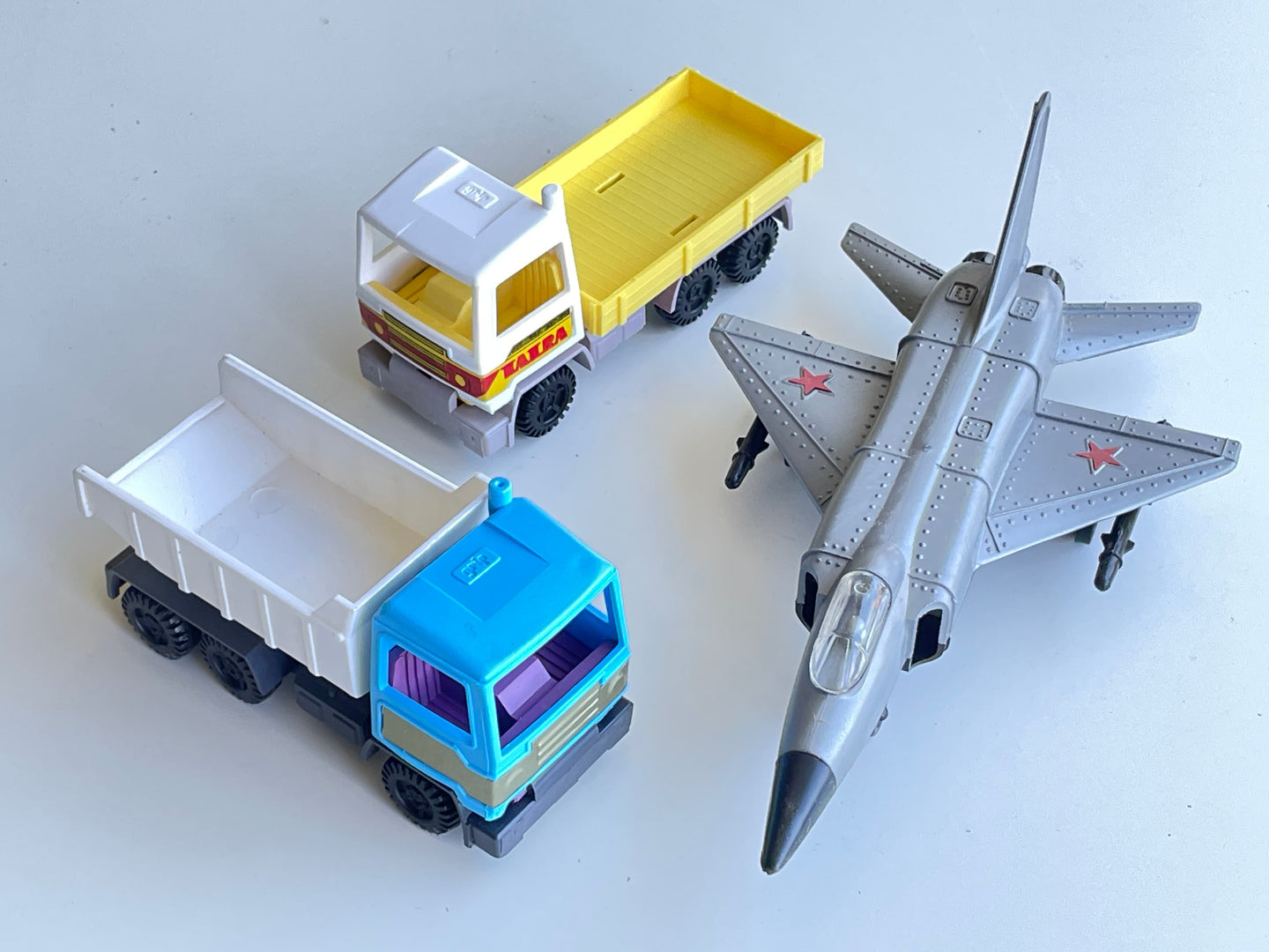 Soviet Fighter Jet Model with 2 Cargo Truck Models